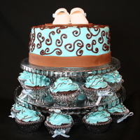 Elegant Baby Boy Shower This was my first cupcake/cake tower. How fun to do! The cake is an 8" coconut cake with buttercream frosting and fondant ribbon. The...