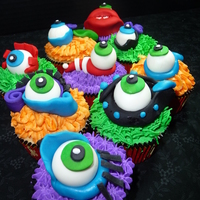 Monster Eye Cupcakes Vanilla cupcakes with Vanilla Buttercream and individual fondant monster eyes.