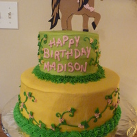 Girl's Horse Birthday Cake Bottom layer is Ebony & Ivory cake filled with Cookies and Cream, small cake on top is Chocolate filled with Peanut Butter Cream. All...