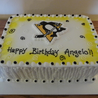 Pittsburgh Pengiuns Cake Chocolate Cake filled with Peanut Butter cream and iced in Vanilla Buttercream.