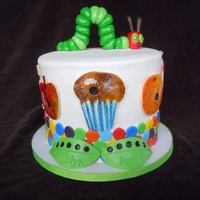 The Very Hungry Caterpillar Inspired by Chocmocakes. 6 inches round by 6 inches tall vanilla with triple berry filling and lemon butter cream.The fondant Cupcake,...