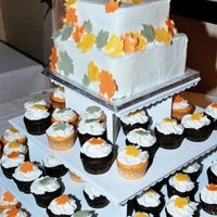 My Sister's Wedding Chocolate 6 and 8 in. Chocolate and orange creamsicle cupcakes for her her fall themed wedding. Buttercream with gumpaste leaves. They lost...