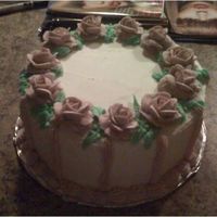 Candee's Birthday Cake Birthday cake for a friend. Yellow cake with raspberry buttercream filling. Royal icing roses. TFL.