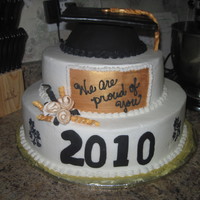 Graduation 2010 Thks so much for the inspirations on here.Especially, cakesbyBert. Buttercream icing, fondant accents. Cake ball pan for cap and cardboard...