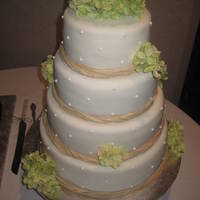 Country Cake With Rafia MMF Covered... rafia I bought at Hobby Lobby and just gathered it, twisted and tied a knot at the back of each cake... Fit the decor...