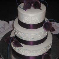 Eggplant Calla Cilly Cake First all buttercream wedding cake... first time I ever made gumpaste flowers as well. Was so excited with how it turned out. Real ribbon....