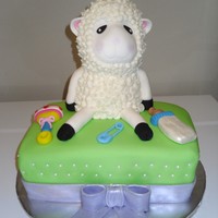 Baby Shower Cake I tried to copy the lamb from "springlakecakes", it was so fun!!!! the decorations are all MMF except the wool on the little lamb...
