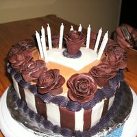 Chocolate !!!roses!!! Chocolate cake, white and regular chocolate fondant stripes and roses. With peanut butter in the middle.