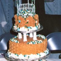 Basket Full Of Flowers Cake This was my first wedding cake. It was for a relative who was having a western theme wedding complete with groomsmen in overalls, and straw...