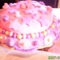 First Fondant Cake! Pink And Purple For Princess Evie :)! I made this cake as a practice run for my daughter's 5th birthday. We stummbled on Cake Cental through Google when she told me she...