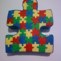 Autism Cake This cake is for an Autism charity event. I had lots of fun doing it. It was vanilla cake with vanilla pudding. Hope u like it as much as I...