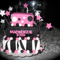 High School Graduation Cake This is a vanilla cake with chocolate frosting inside. It is covered in fondant. I made this for a girl who graduated from high school it...