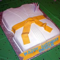 Karate Birthday Cake This is my first attempt at a cut out cake. Its all fondant. I really like how it came out and my cousin loved it!