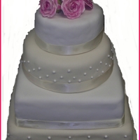 Pink Flowers Wedding Cake Wedding cake with pink roses on top