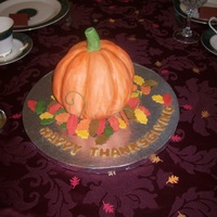 Pumpkin In Fall i just used a circle cake pan and carved it out into the shape of a pumpkin, covered it with homemade MMF. the leaves are made out of GP