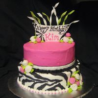 Sassy Zebra All buttercream with fondant topper and whimsical roses. The twists are gumpaste.
