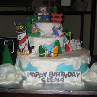 Club Penguin Birthday This was designed after the Club Penguin online characters. All buttercream with gumpaste 2D buildings and penguin characers.
