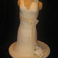 Replica Wedding Dress Cake This was a replica of the bride's wedding dress done for a bridal shower. It consists of 2- 12" layers, 4 9"layers, 2- 8&...