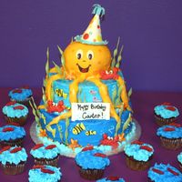 Octopus Party Buttercream covered cake, topped with a fondant octopus (covered cake). I handmade some sealife and used molds for others. Seaweed and...