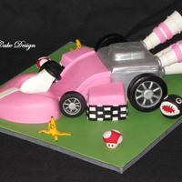 Pink Mario Kart Cake. I made this 3D hand carved mario kart (from the wii) for my little girl's 5th birthday party today! She's obsessed with Princess...