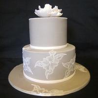 Brushed Embroidered Wedding Cake Taupe coloured icing (looks a little grey in this pic). Then some open rose brush embroidery... and small piped dots on the top tier. And a...