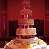 Rhinestone Reflections All buttercream icing, Mirrored spacers and lots and lots of rhinestones. Bottom cake tier measures 48 inches in diameter. White, chocolate...