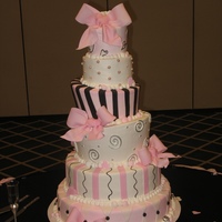 Pretty In Pink Six tiers with buttercream icing and fondant bows. Stripes and pearls were also out of fondant.