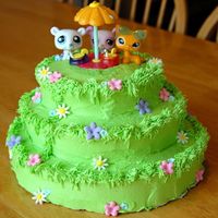 Littlest Pet Shop Picnic This cake was very last minute for an 8 year old girl. I wish I had more time so that I could have hand sculpted the animals, but the...