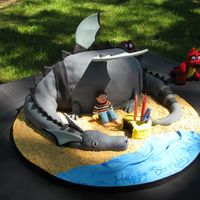 Puff The Magic Dragon Cake This cake was made for my son's 4th birthday. He wanted a black and gray Puff the Magic Dragon cake with himself as Jackie Paper. The...
