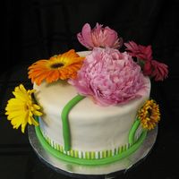 Flower Cake This cake was made for a birthday and for Mother's day. It is a chocolate cake with oreo cookie goat cheese frosting. All ingredients...