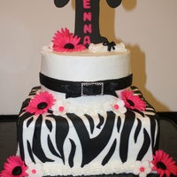 Jenna Graduation 11" and 9" white cake with buttercream frosting and fondant accents. She did not want the traditional school colors and cake.