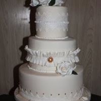 White On White, Well... Ivory! traditional white on white (ivory!) with sugar roses. I love making roses!