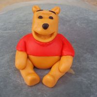 Fondant Pooh My first attempt at a fondant Pooh for a friend's baby shower. Would love your honest opinions.......does it looks like Pooh? I am a...