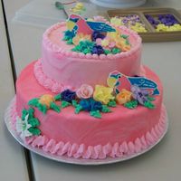 Tropical Theme-Any Occasion Cake My first 2 layer cake of marbled fondant and flowers in royal icing. Birds done with color flow. Buttercream ruffle around large cake....