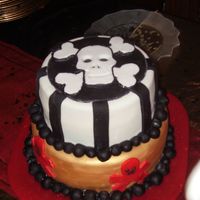 Priate Cake Two Tiered Chocolate Cake, Iced with buttercream, filled with Cream custard, covered with fondant.