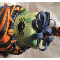 Halloween Theme Birthday fondant covered cake for a 1 year old, mom wanted it to be a Halloween theme- pumpkins are gumpaste, they call the baby 'Pineapple&#...