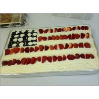 4Th Of July Flag Cake Homemade Very Tasty Vanilla Sheet Cake with Buttercream Frosting. Topped with Fresh Blueberries and Strawberries.