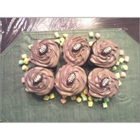 Footbal Topper Cupcakes Twice Filled German Chocolate Cupcakes with Chocolate Ganache and Chocolate Butter Cream. The footballs are made from Fondarific Chocolate...