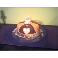 Crown Cake Chocolate Cake W/ Cream Cheese Filling And Icing I needed a cake quick and only ahd 20 minutes to decorate it. Looks very lame but it tasted oh so yummy!!!!!LOL TFL!