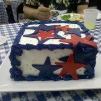 Stars Cake is three layers of wild cherry (red), watermelon/kiwi (white), and mixed berry (blue), flavored with Kool-aid. BC iced with MMF stars...