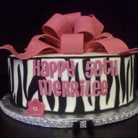 Zebra And Pink Another zebra and pink cake. BC icing with fondant stripes and bow. Client wanted to add some sparkle.