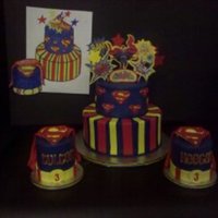 Superman WASC iced in royal blue BC, MMF and RI accents. 8" and 6" stacked rounds. Mini cakes are 3" round X 4" tall. Original...