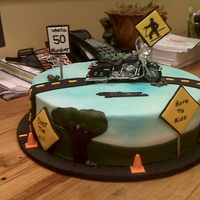 Over The Hill Buttercream iced WASC with fondant accents. Harley is a toy. Inspired by a cake found here on CC, don't remember whose it was sorry.