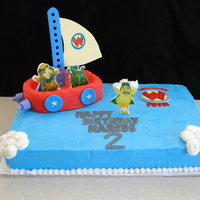 Wonder Pets This was half chocolate, half yellow 1/4 sheet with BC. Gumpaste accents, RKT boat covered in MMF with gumpaste accents. TFL!
