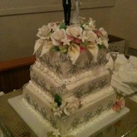 White And Silver The main colors of the cake were white and silver highlight but I got to add a splash of color with the gumpaste flowers :)This was my...