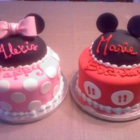 Minnie And Mickey The hats were made of RKT covered in white choc to smooth it out then black fondant. The ears and bow were gumpaste. Thanks for looking...