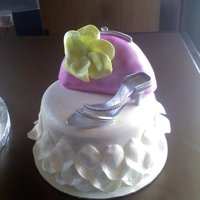 Barbie Accessory Cakes These cake went on both sides of the barbie cake. The bride to be also wanted shoes and purses. The purses are made with RKT covered in 50/...