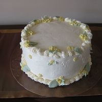 My Cousin's Birthday Cake Yummy light sponge cake (3 layers) passion fruit mousse filling and SMBC frosting and piped decorations.