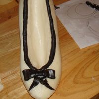 Chocolate And Fondant Shoe i used a shoe mold and made it with white candy melts. and covered the imperfections with the fondant to match the purse