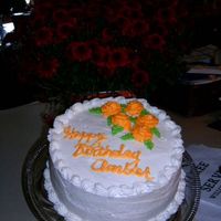 Amber's Birthday White cake with white buttercream and yellow roses. Shell bottom border with reverse shell around the top.